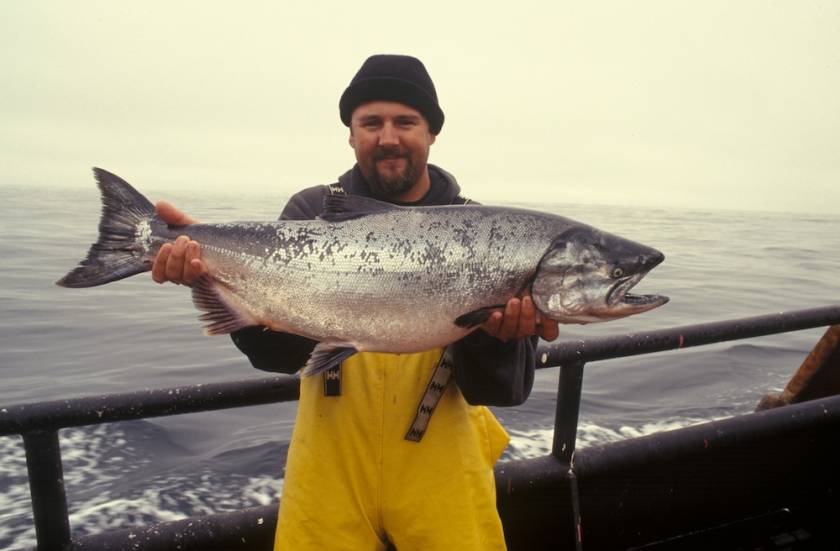 man holding huge catch during fishing tournament